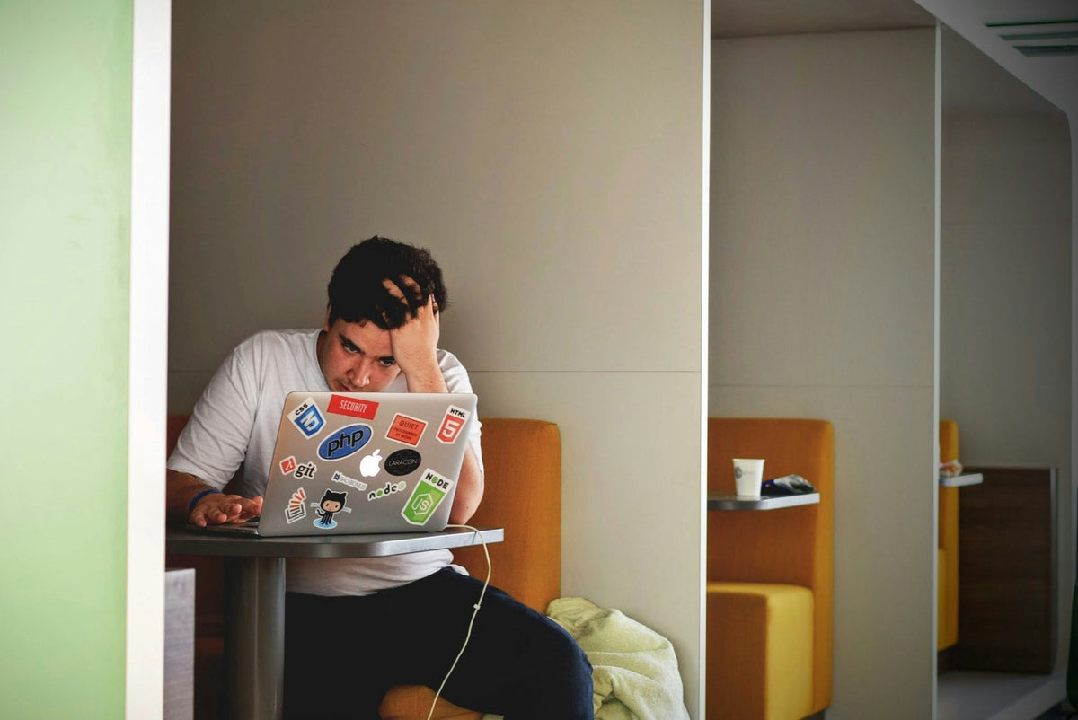 man working on his computer 