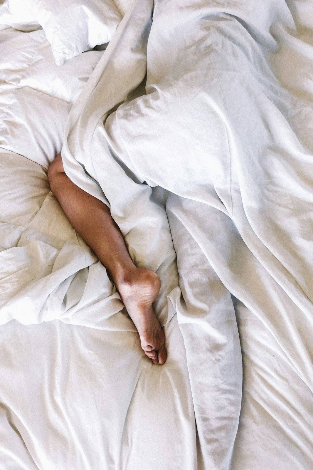man sleeping in a bed