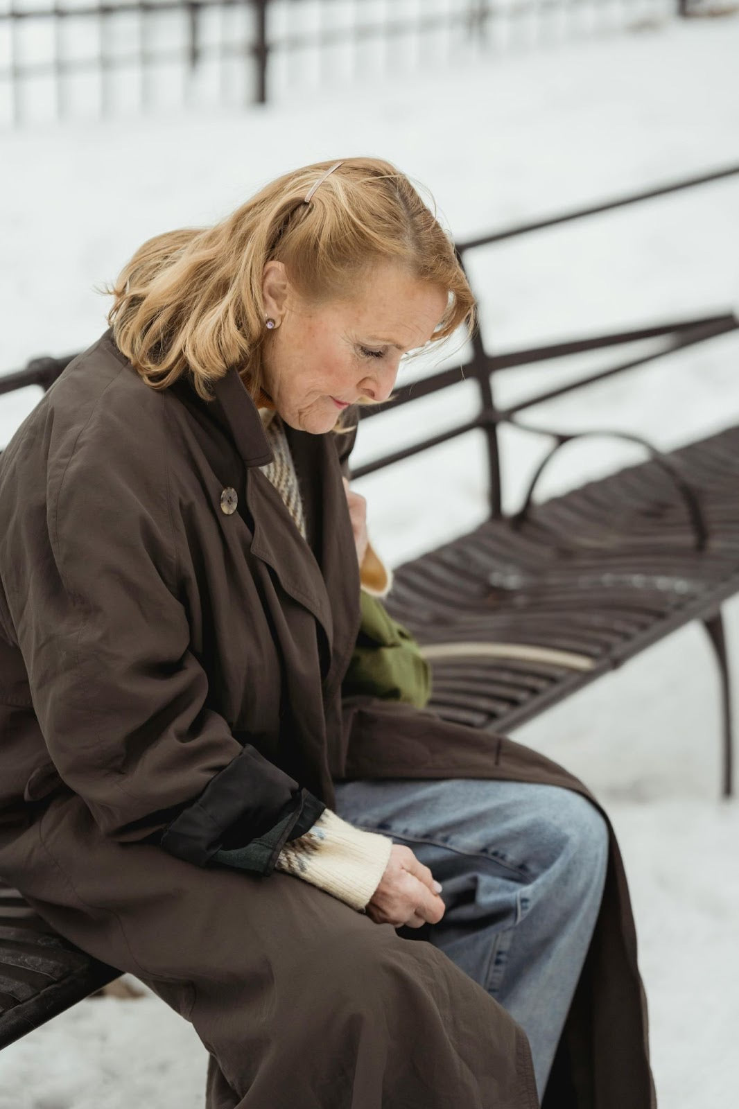 woman sitting on a bench in winter