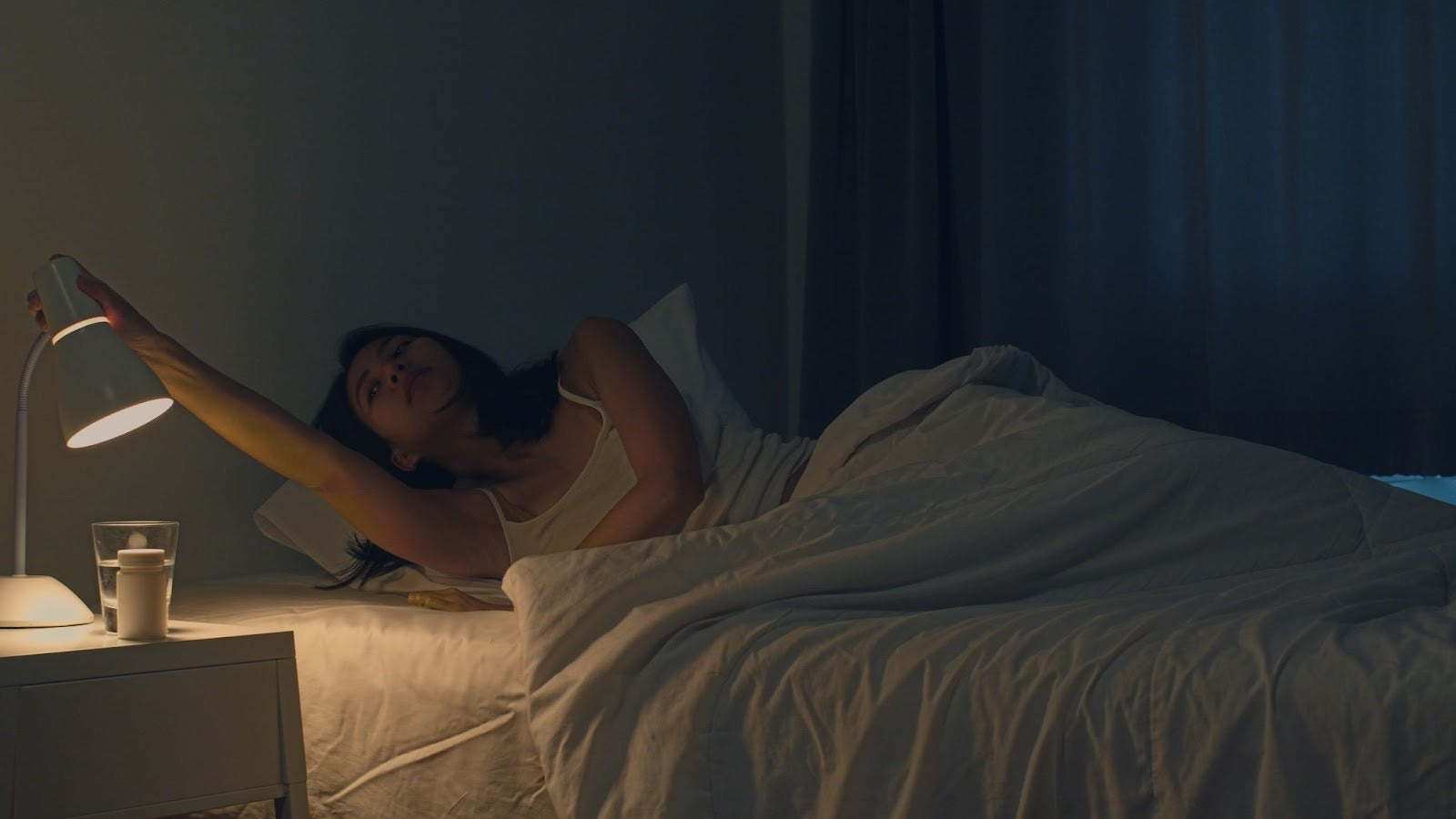 young woman waking up at night